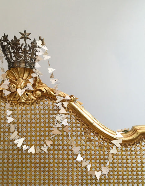 Tenderly cut from the pages of old novels and French music paper, these delicate garlands transport you back in time...their soft patina whisper times past. 